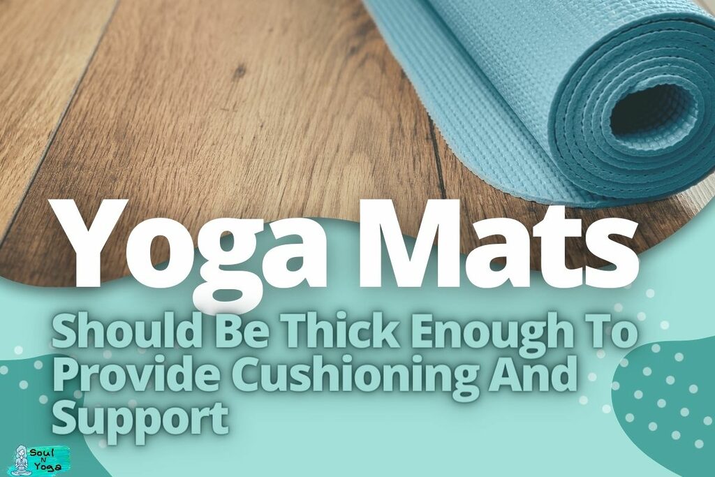 A blue yoga mat rolled on the floor